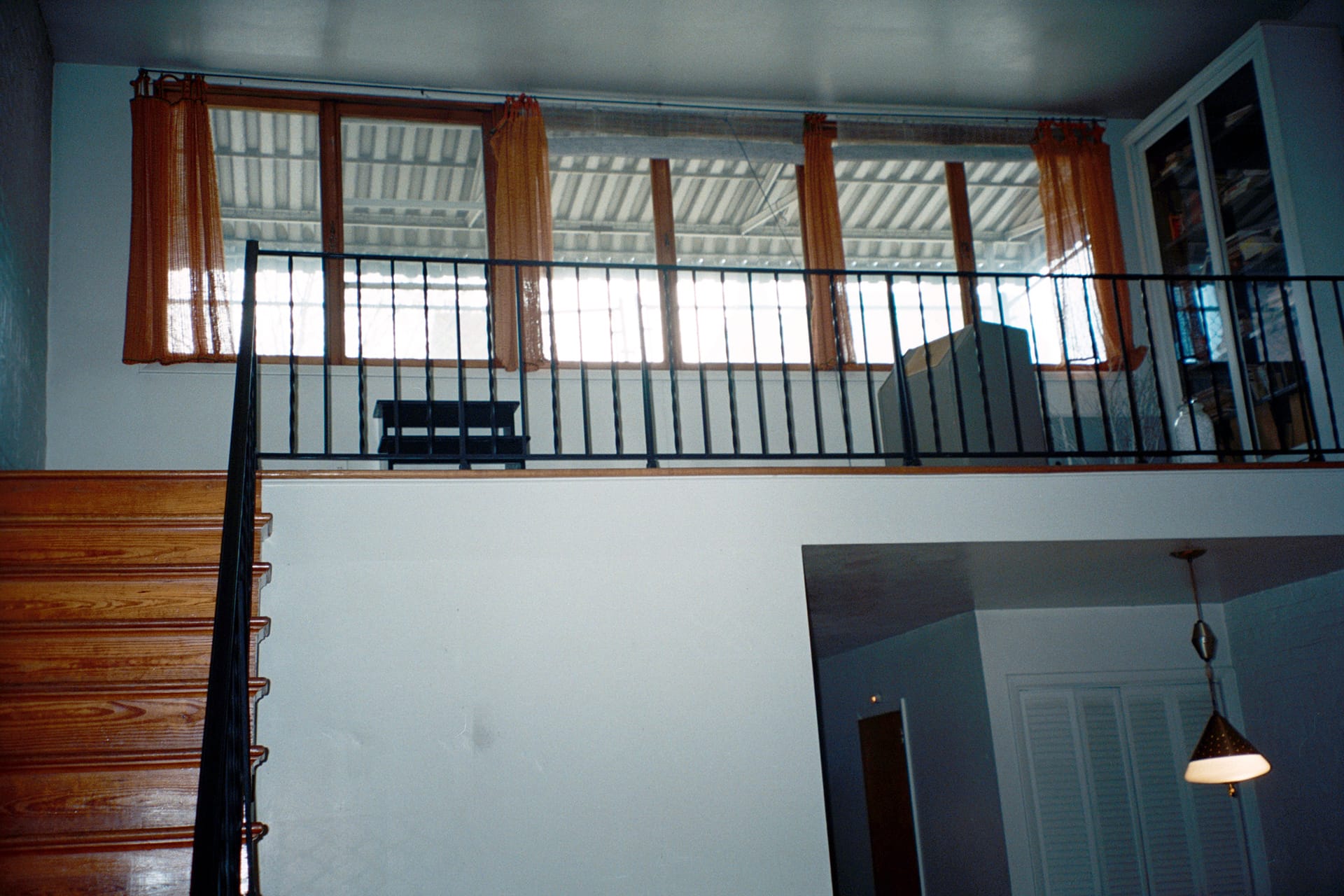 View of a double height space in a carriage house before our renovation.