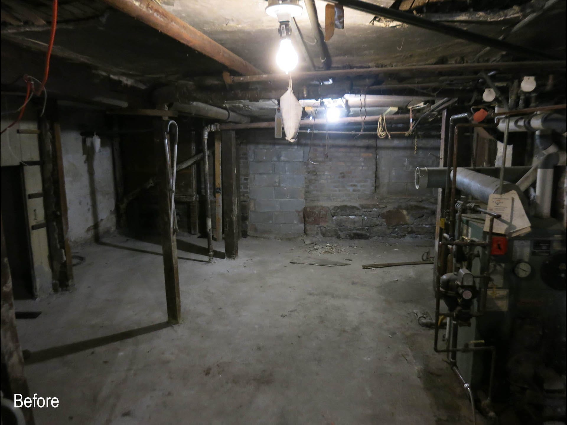 Unfinished basement of a Brooklyn Heights colonnade rowhouse before our renovation.