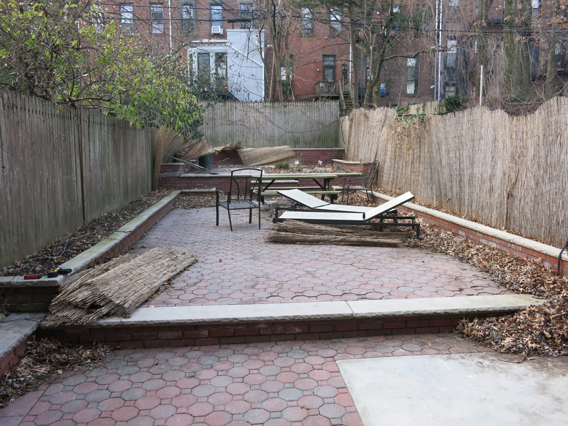 Rear yard of a Prospect Heights brownstone with red pavers